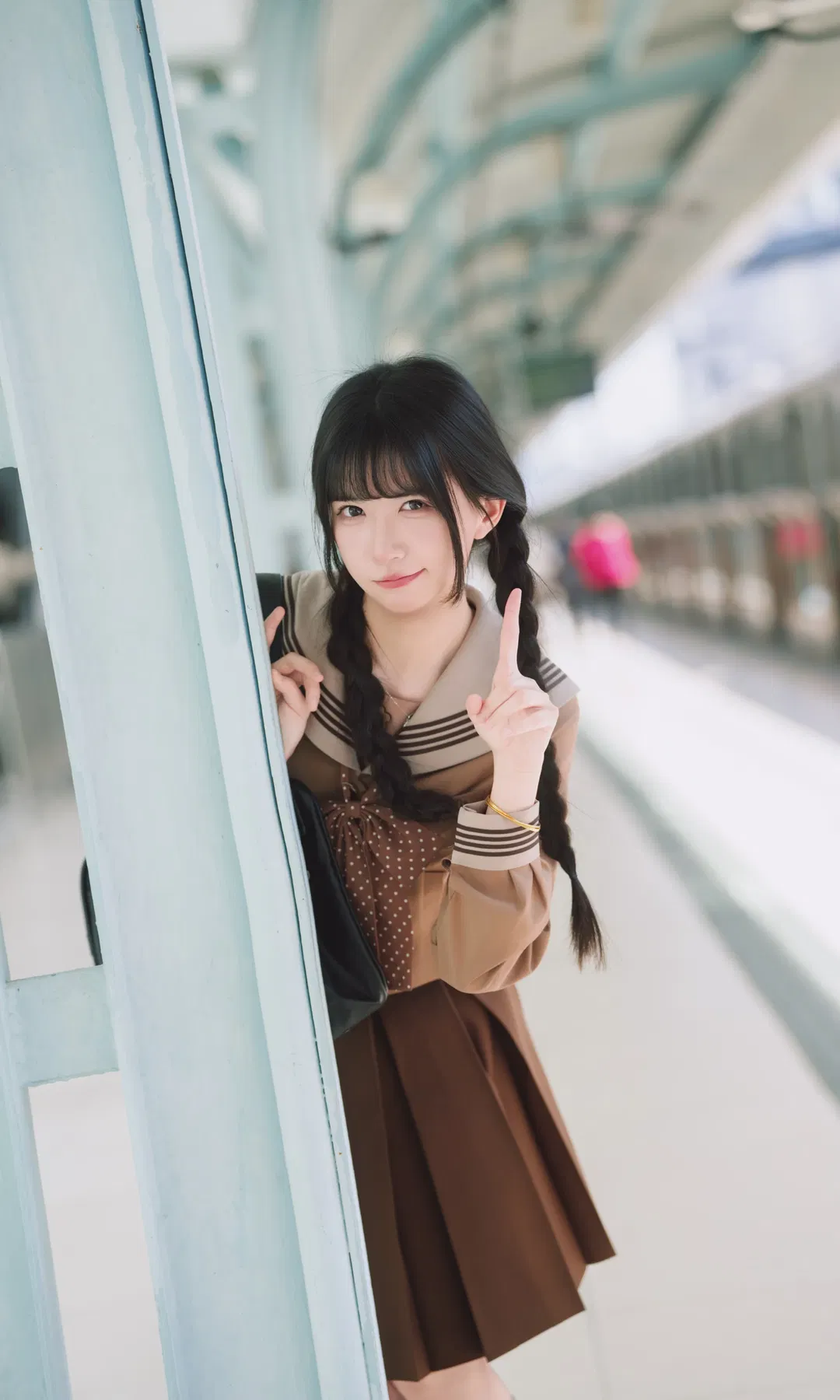 Autumn caramel brown-toned uniform photoshoot: Japanese style photography aesthetics on the station platform - Image 2