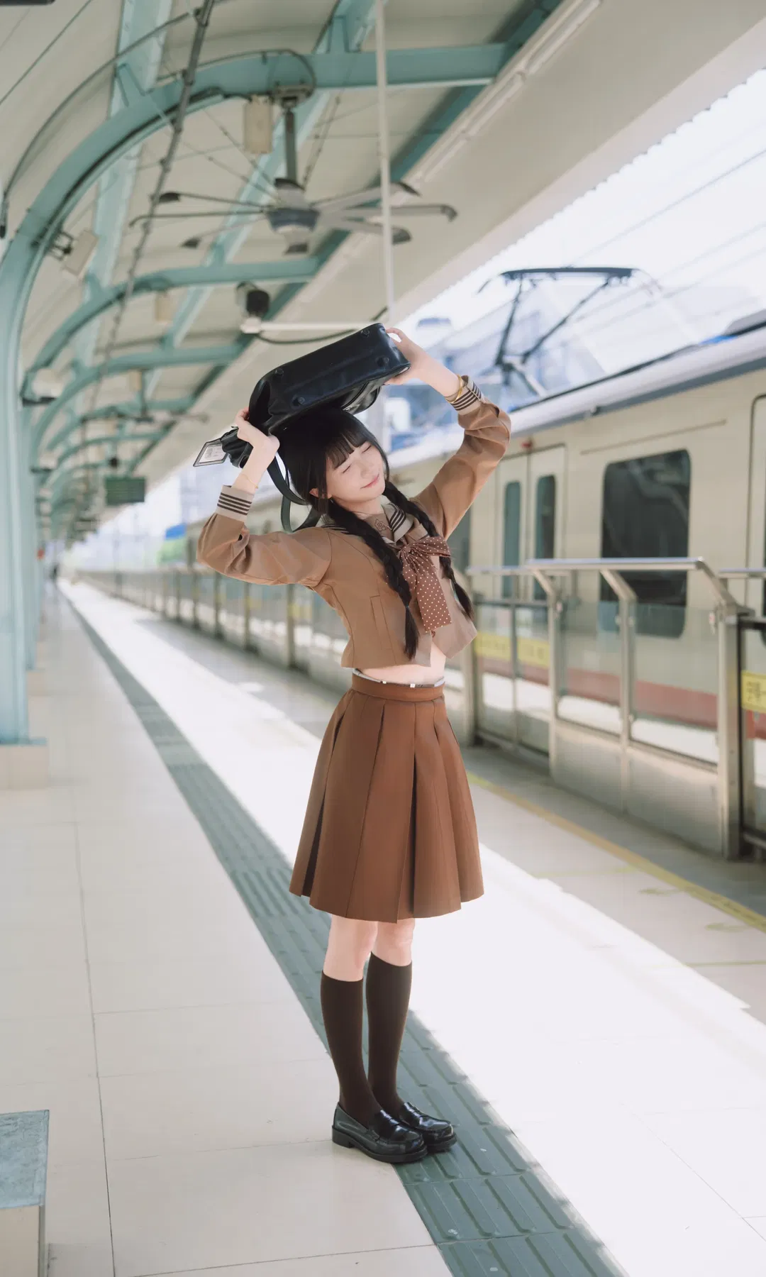 Autumn caramel brown-toned uniform photoshoot: Japanese style photography aesthetics on the station platform - Image 6